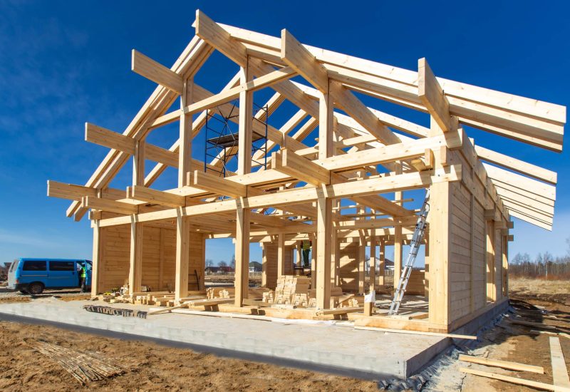 Construction of a house made of laminated veneer lumber. The frame of the house. Cottage made of laminated wood. Erection of the frame of the cottage. Manufacture of houses made of wood.